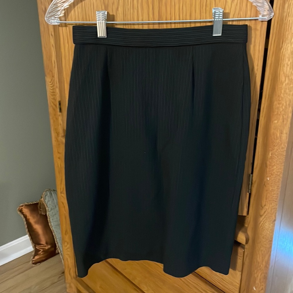 Black pinstriped pencil skirt. Size 4